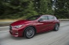 Driving 2019 Infiniti QX30S in Magnetic Red from a front left three-quarter view